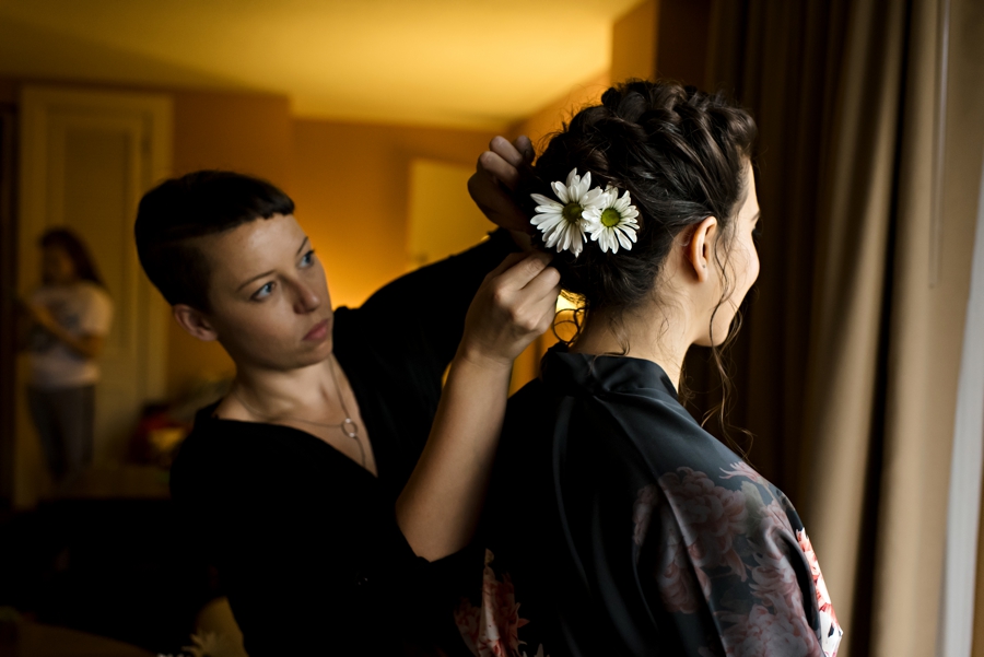 A bride getting flowers in her hair before the wedding in Philadelphia.
